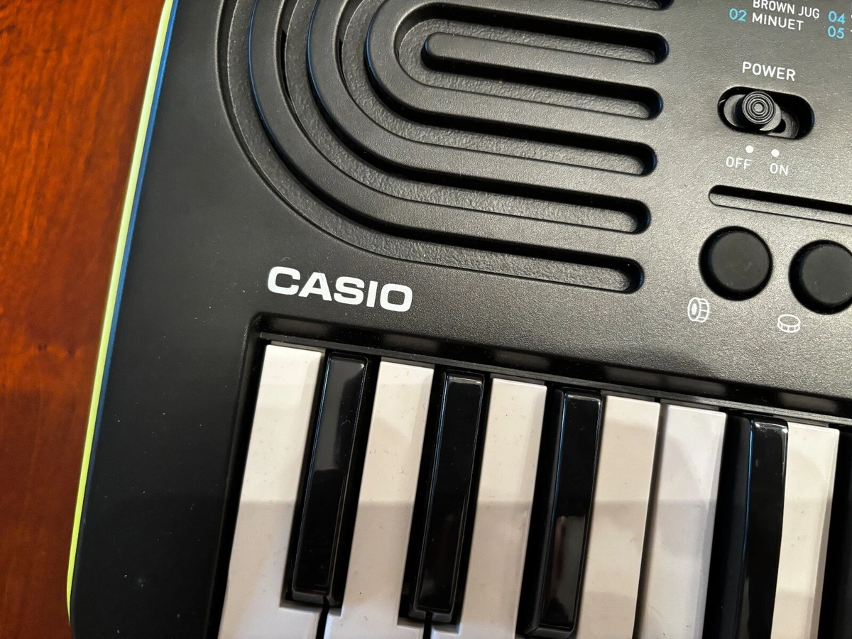 Casio SA-46 Mini Keyboard, Black & Green 32 Keys 100 Tones 50