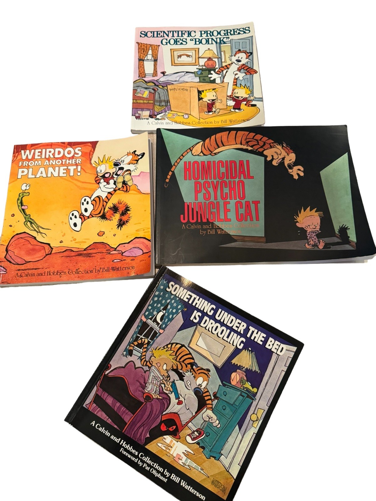 Calvin and Hobbes Paperback 4-Book Set by Bill Watterson Including Another Planet Homicidal Drooling