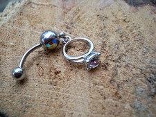 belly button ring with a ring charm piercing ...
