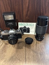 Minolta XG-1 35mm SLR Film Camera w/Auto 200x Flash And Zoom Lens
