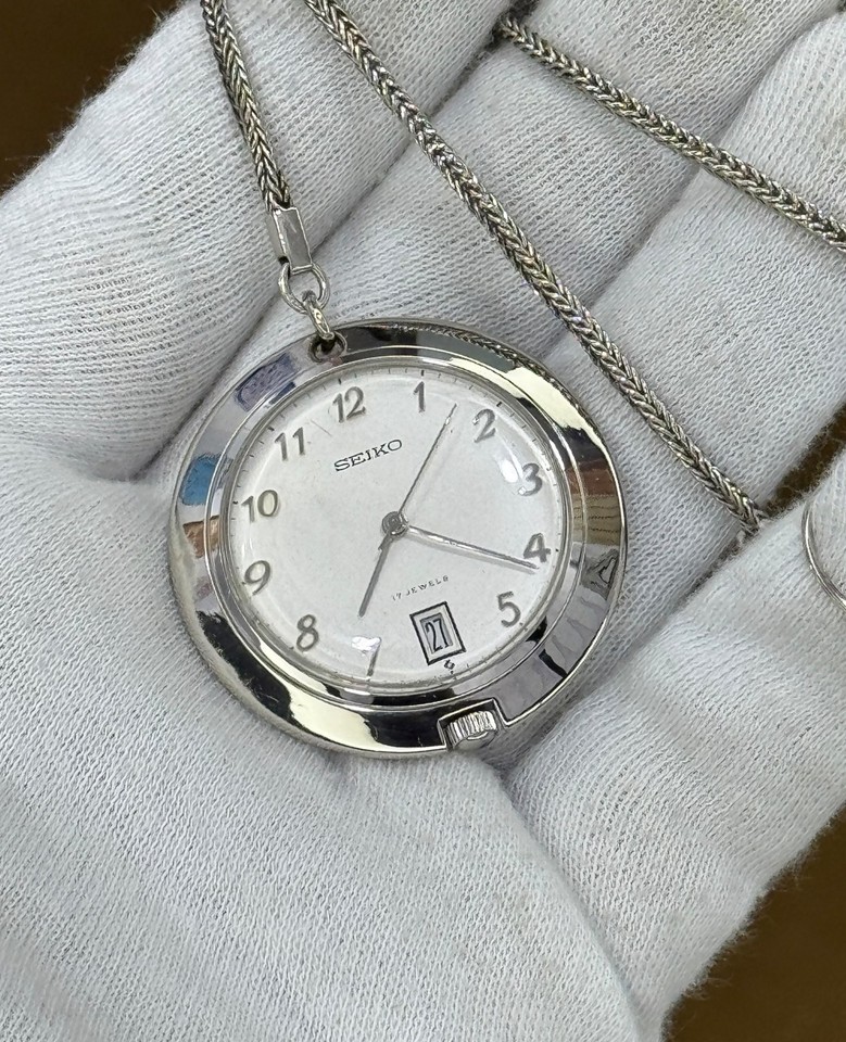 A 1970s Seiko automatic pocket watch with date — Japanese mechanical ingenuity from a golden era, still ticking and complete with chain.