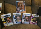 4 Wonder Woman Funko pops and 1 wonder Woman Die cast