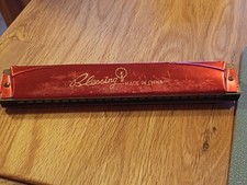 Armonica a bocca di colore rosso