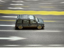 Auto World Mighty Minivans 1985 Plymouth Voyager Ultra RAW Chase  - Loose