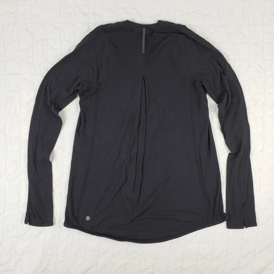 Top LULULEMON Talla 6 Negro Tuck And Flow Manga Larga $78 Foto 4 de 4