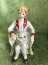 GR 44 Figurine - Young Man Sitting Cross-Legged in a Chair with a Top Hat on his