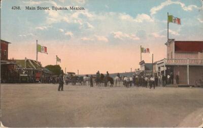Tijuana, MEXICO - Main Street / Avenida Revolución 1911 - flags, horse & wagons