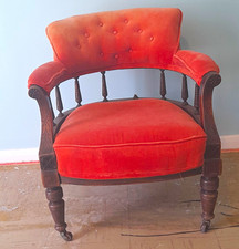 Orange Upholstered Accent Chair, Padded Seat, Dark Wood Frame, Castors