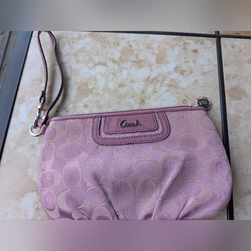 Coach Pink Clutch with Signature Pattern and Wrist Strap