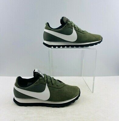 white nike shoes with green swoosh