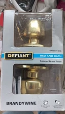 Defiant Brandywine Polished Brass Bed And Bath Door Knob Lock Set