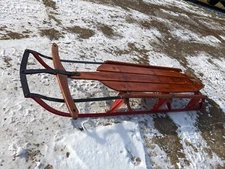 antique wooden metal sled, lightning fast.