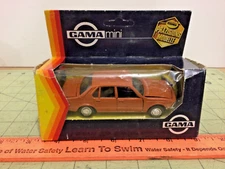 Vintage 1:45 copper colored BMW 733i die cast car by GAMA of West Germany