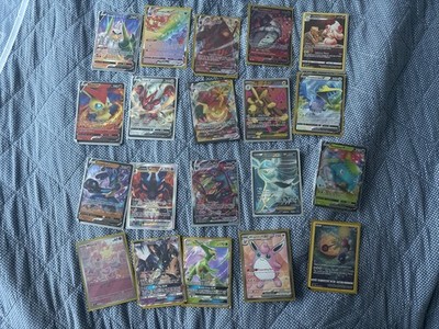 20 Pokémon cards. Five  v maxes. Seven Vs. One V star.  two GX s. 2 Ex. full art