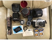 Topcon 35mm slr camera, working, Excellent Condition With Cases