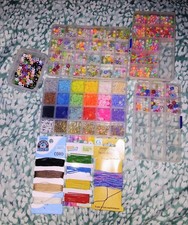 Plastic and clay beads for jewelry making, and string