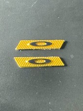 OAKLEY SUTRO LITE SUNGLASSES REPLACEMENT SIDE LOGO ICON TEMPLE GOLD  BLACK TAG