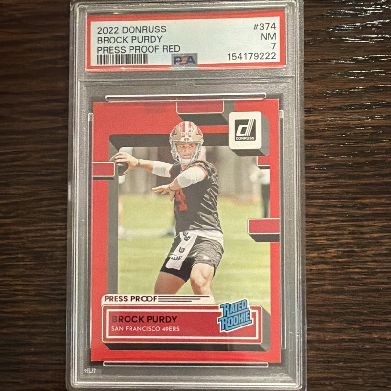 2022 Panini Donruss Brock Purdy Rated Rookie Press Proof Red #374 PSA 7 49ers