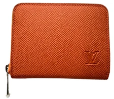 Louis Vuitton zippy coin purse wallet orange color. Appears to be new. 