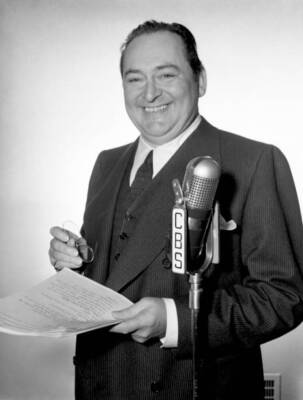 Edward Arnold poses for a photo at a microphone for The Radio pr 1940s Photo 1