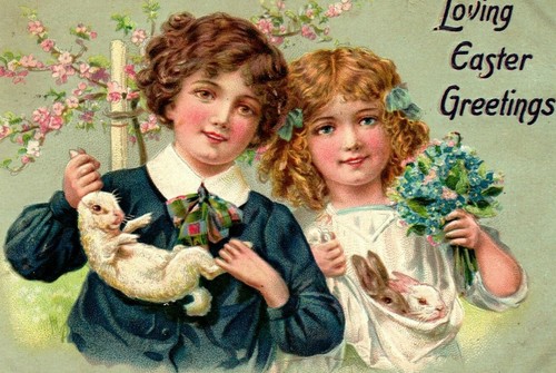 Tarjeta postal Tuck's Easter Greating niño y niña con conejos y flores BB2 - Imagen 1 de 3