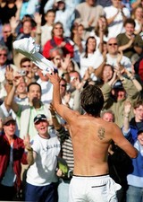 Goran Ivanisevic of Croatia throws his shirt to the crowd after h- 2004 Photo