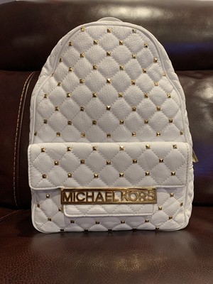 white studded backpack