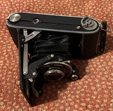 Antique Kodak Tourist folding Roll Camera with leather case.