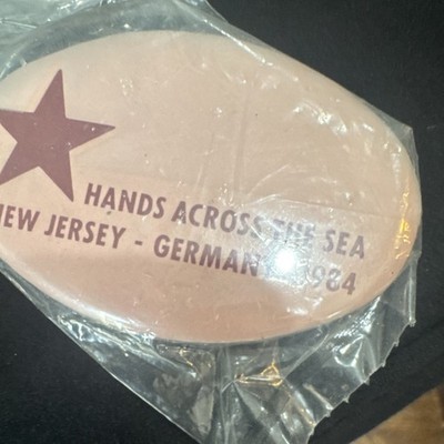 Hands Across The Sea New Jersey Germany 1984 Pinback Oval Pink Star Badge