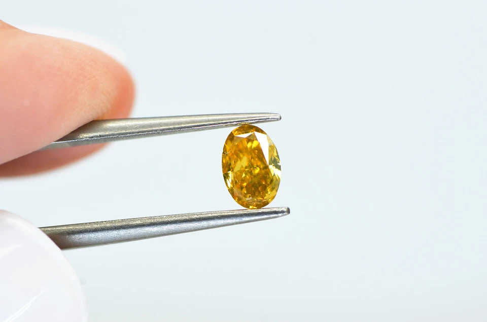 Fancy Orangey Yellow Diamond Loose Oval Shape VS1 Natural Enhanced 0.53 Carat - Image 4 of 4