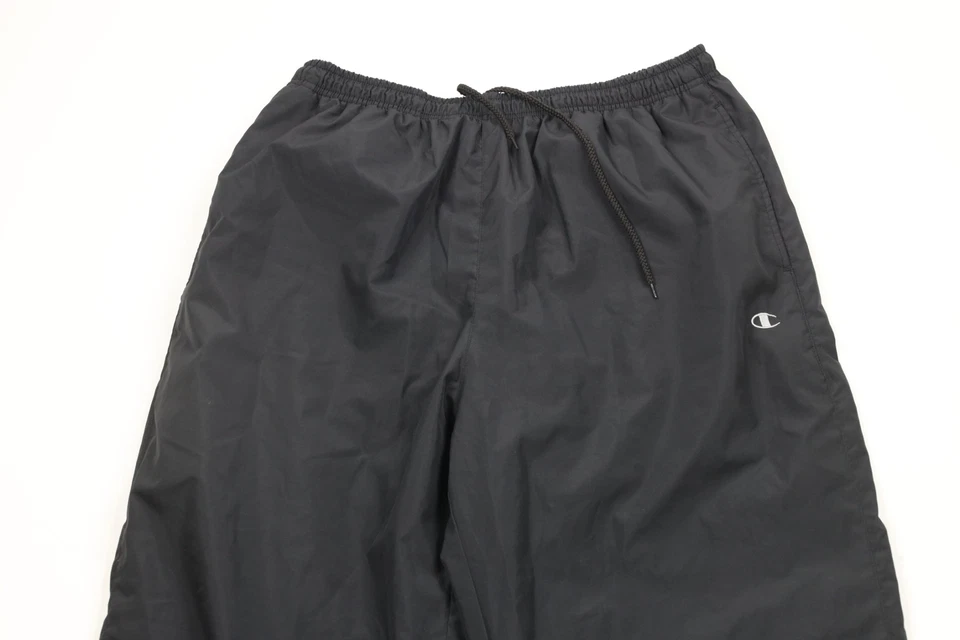 Pantalones cortavientos vintage años 90 Champion para hombre grandes clásicos forrados pierna ancha Foto 2 de 4