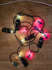 string coca-cola lights 10' with round coca-cola sign and contour bottles....