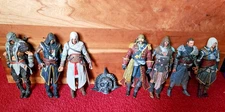 Assassin's Creed Figures - Lot of Seven Loose Plus Skull Buckle