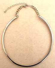 Gold tone, curb link and open rigid circle, necklace
