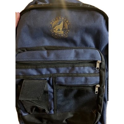 Defenders of Wildlife Backpack Established 1947. Color Navy BLUE. 12 POCKETS 