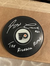 REGGIE LEACH AUTOGRAPHED FLYERS PUCK W/COA THE RIVERTON RIFLE INSCRIPTION
