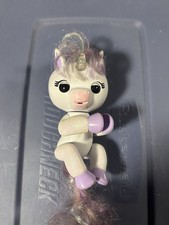 WowWee Fingerlings Interactive Unicorn Toy White with Purple Glitter Hooves