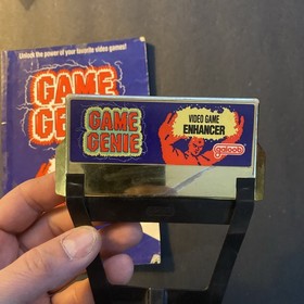 Galoob Game Genie 7356 for NES Gold with Programming Manual  Codebook