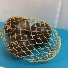 Nautical Net With Three Ornate Balls Like Coconuts Shape