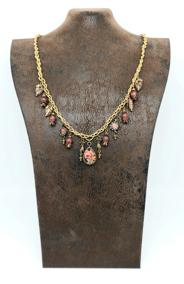 Precioso Michal Negrin tono dorado con coloridas flores y cristales únicos. Foto 2 de 4