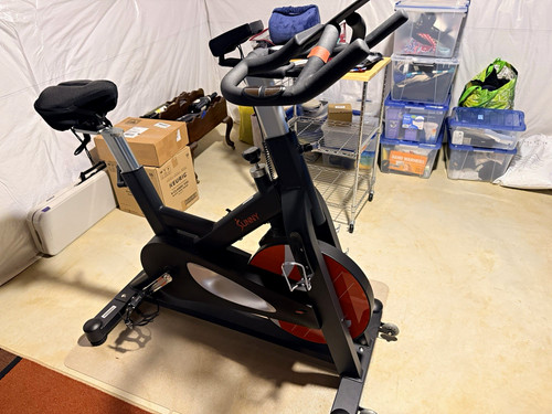 Sunny Upright Exercise Bike w/ Bottle Holder, Transportation Wheels Black/Red