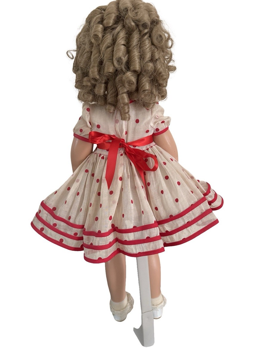 shirley temple red polka dot dress The legendary child star Shirley Temple, in her iconic red polka dot dress, famously worn in the 1934 film Stand Up and Cheer, in her "Baby, Take a Bow number. It became