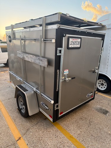 8 ft enclosed trailer completely set up with solar panels and washer/dryer