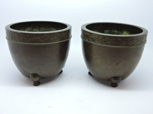 Pair of Chinese Bronze handled small urns.