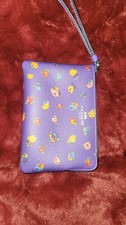 Used Authentic Sport Purple COACH Wristlet with Vintage Rose Print. Used Once