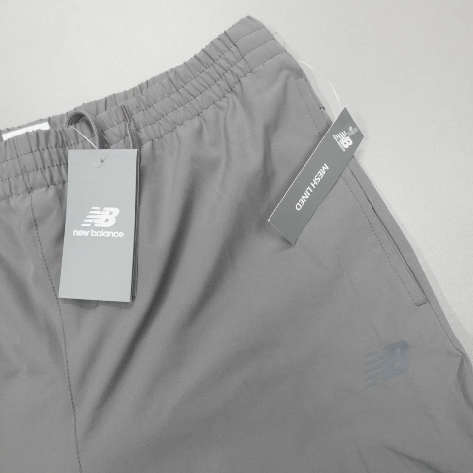 Pantalones de correr New Balance All Motion para hombre talla M gris forrados de malla cremallera al tobillo Foto 2 de 4