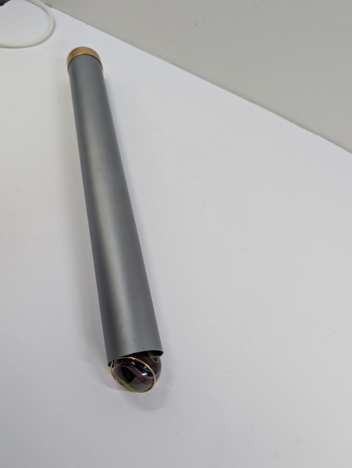 Artisan-made brass kaleidoscope with a marble object cell — the spinning marble creates wildly unpredictable patterns no two people see the same way.