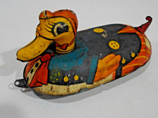 DUCK PULL TOY- ROLLS FREELY- ALL TIN