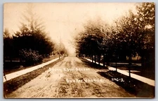 Bunker Hill~Dirt S Elm St Lined by New Trees~Long Fence on Other Side RPPC 1910