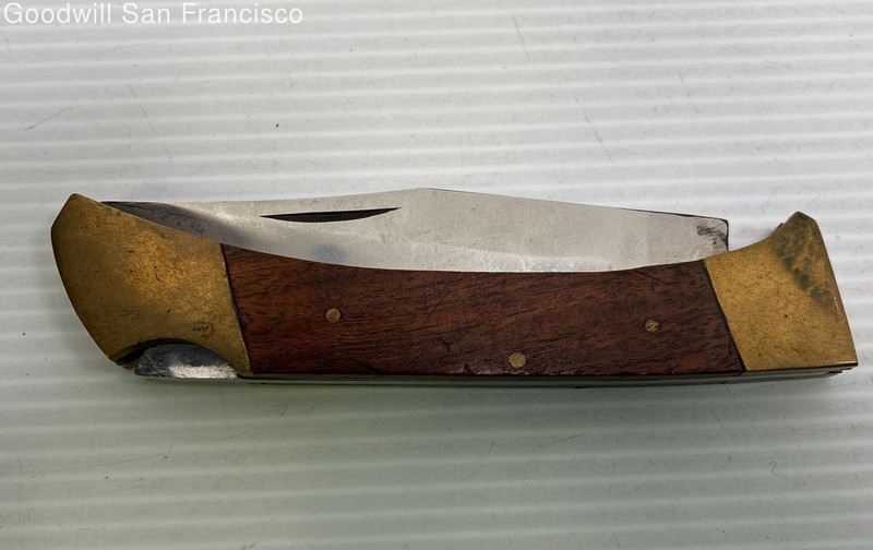 Vintage Folding Lock Blade Knife Featuring a Wood Handle & Brass Bolsters